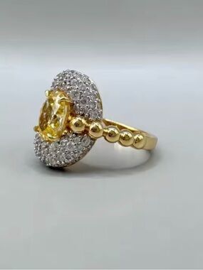 Gold Ring with Yellow Gemstone and Halo Accent